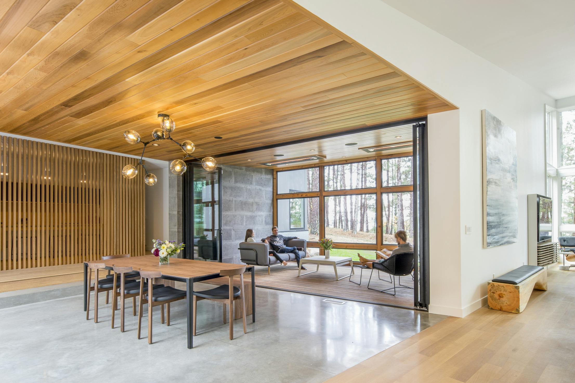 Inviting Lakeside 3-Season Porch with Folding Glass Door System